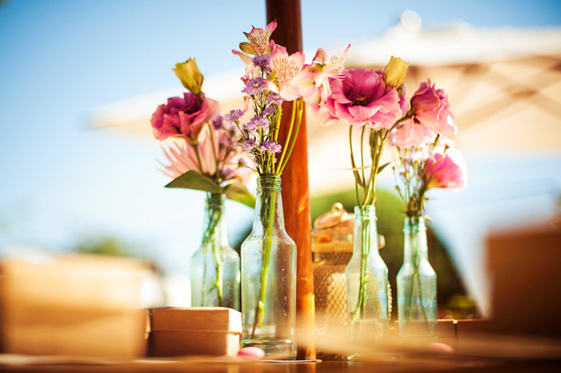 Flowers in wine bottle for wedding